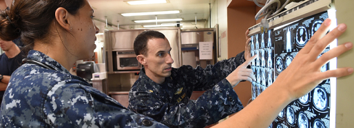 Emergency medical physicians look at a patient’s CT scans.