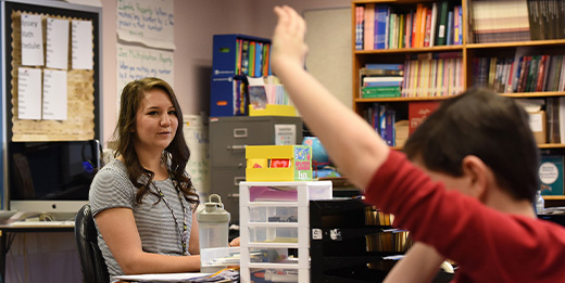 Child raises hand in class