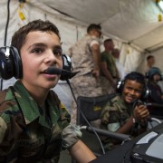 A young boy wears a headset.