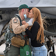 Service member kisses loved one