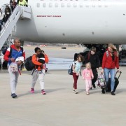 People leaving plane