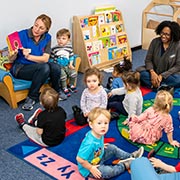 Staff and children in child care center