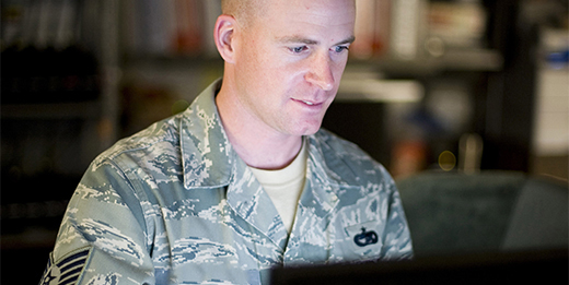 Service member using a computer.