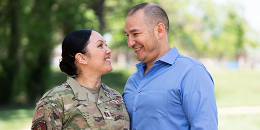Military couple smiling at each other
