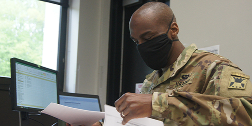 Service member working at desk