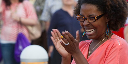 Woman smiling and clapping