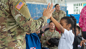 Students in class with service members
