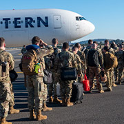 Military members boarding plane