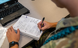 Service member taking notes
