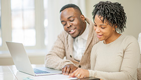 Couple working on laptop