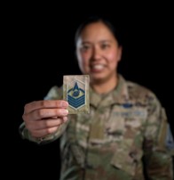 Service member holding card