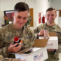Service members opening packages