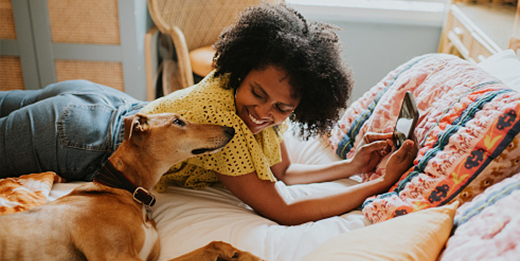 Person reading and relaxing with pet