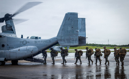 Service members boarding a plane