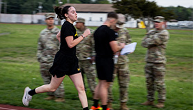 Service member running in race