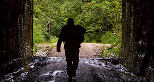 Service member walks through tunnel