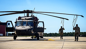 Service members greet school children
