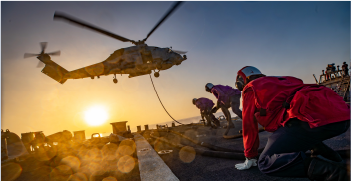 Service Member landing helicopter