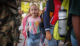 Girl walking into school