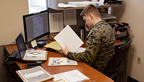 Service member at computer doing taxes