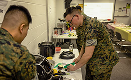 Service members take cooking class