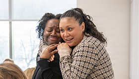 Two women sharing a hug