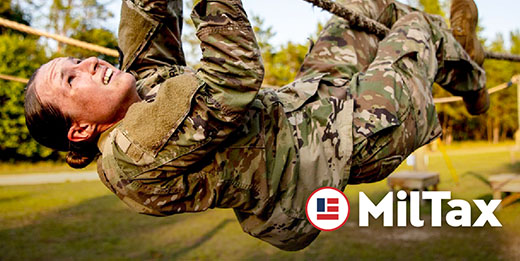 Service member climbing on rope