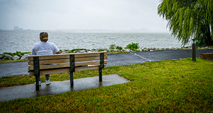 Service Member sitting on bench