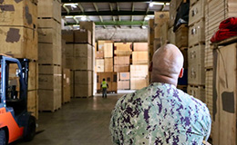 Service member views household goods