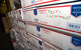 Christmas mail packages stacked upon eachother.