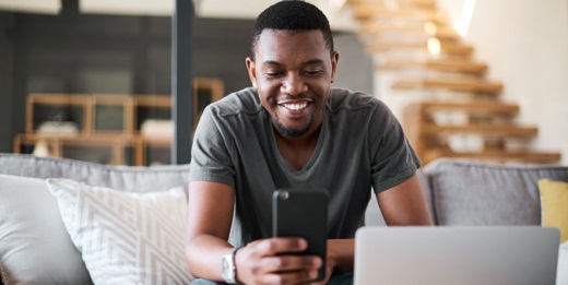 Man on phone and laptop