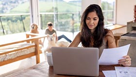 spouse at desk with laptop