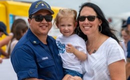 U.S. Coast Guard member with his wife and daughter