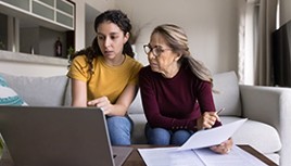 Two woman working on computer