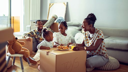 Family having breakfast in new home