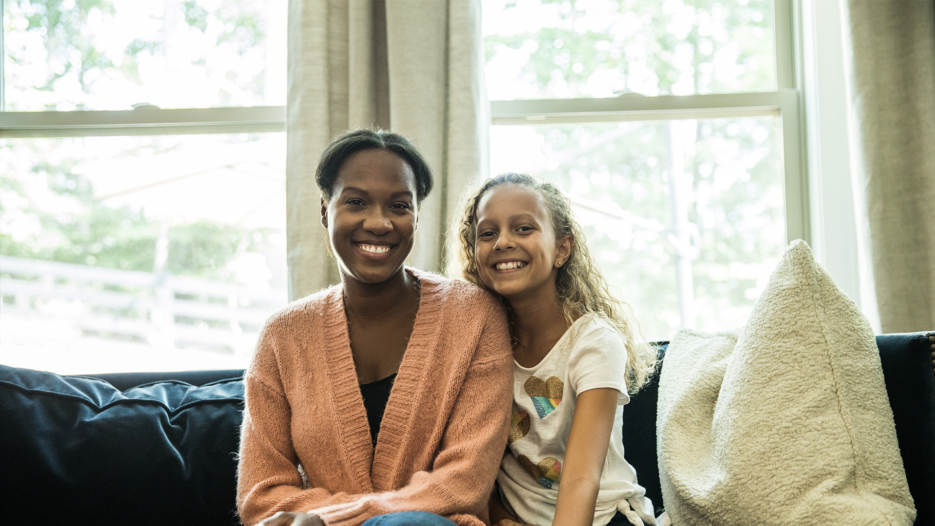 Child smiles with mentor