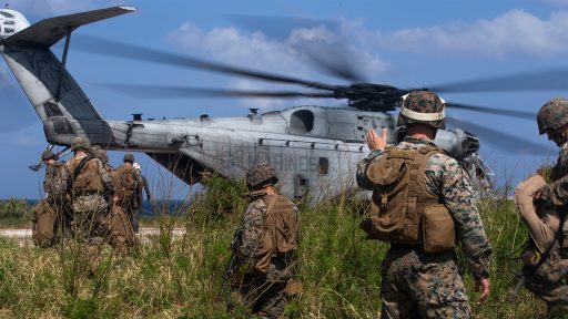 Marines preparing helicopter for deployment