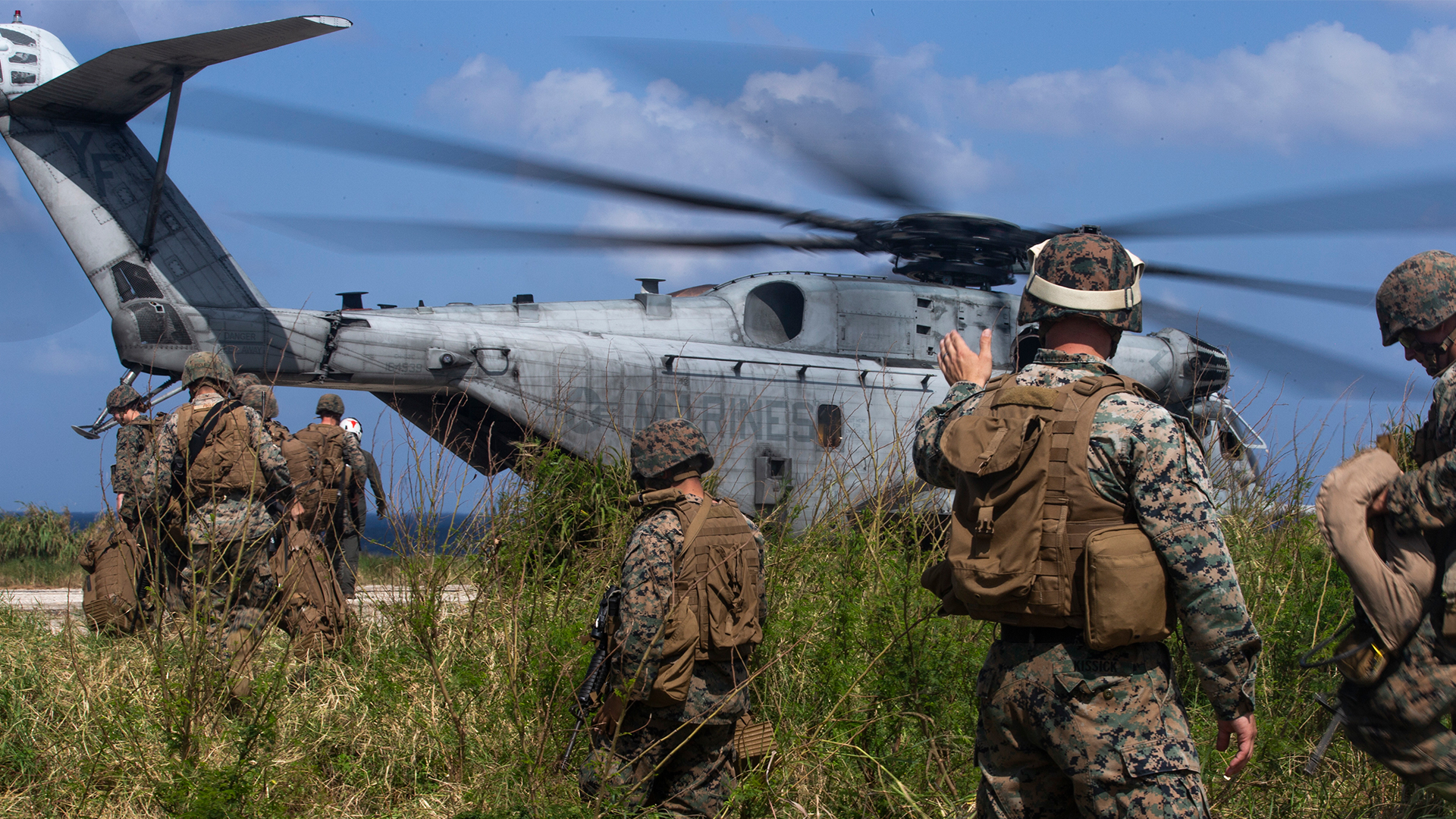 Marines preparing helicopter for deployment