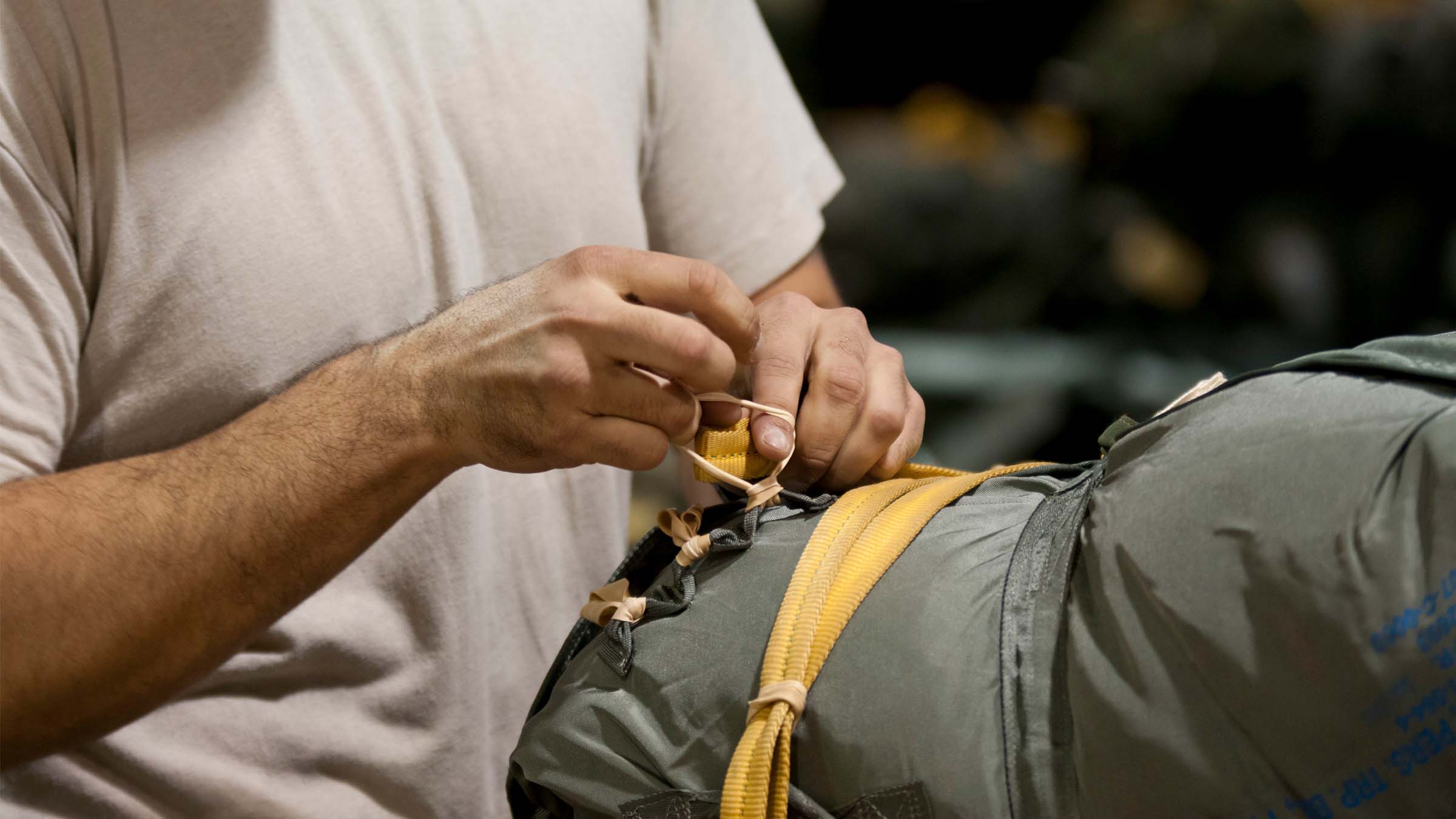 Service Member packs his gear