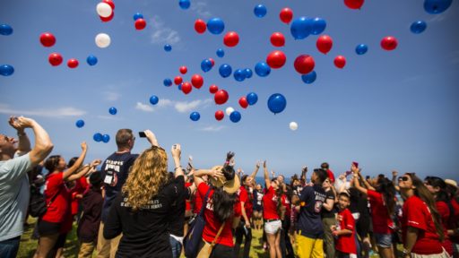 Family members release balloons to honor fallen marines
