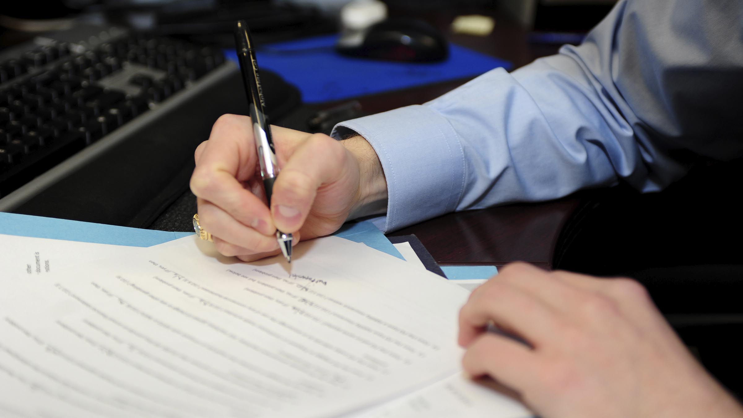 Intern fills out papers in legal office