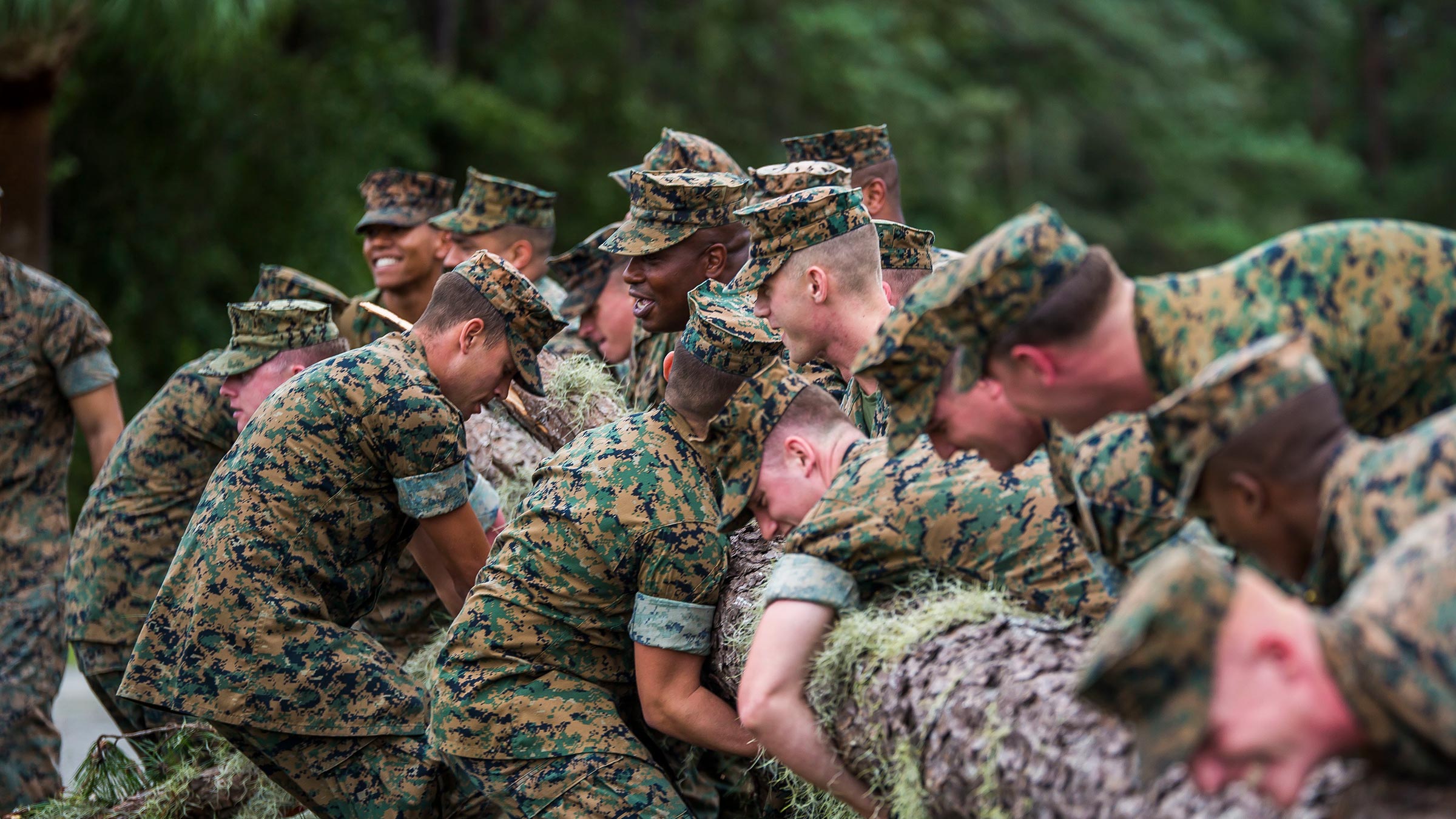 A group of service members training together