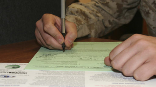 Service member filling out tax form