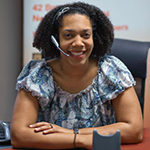 A woman wearing a headset