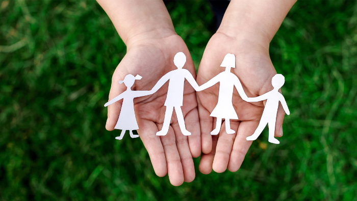 A paper cut out of a family of four