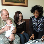 Parents with baby and counselor
