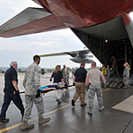 Service members entering a plane