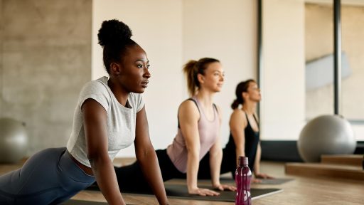 persons in yoga class