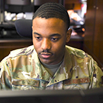 Service member at computer