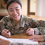 Service member going over files